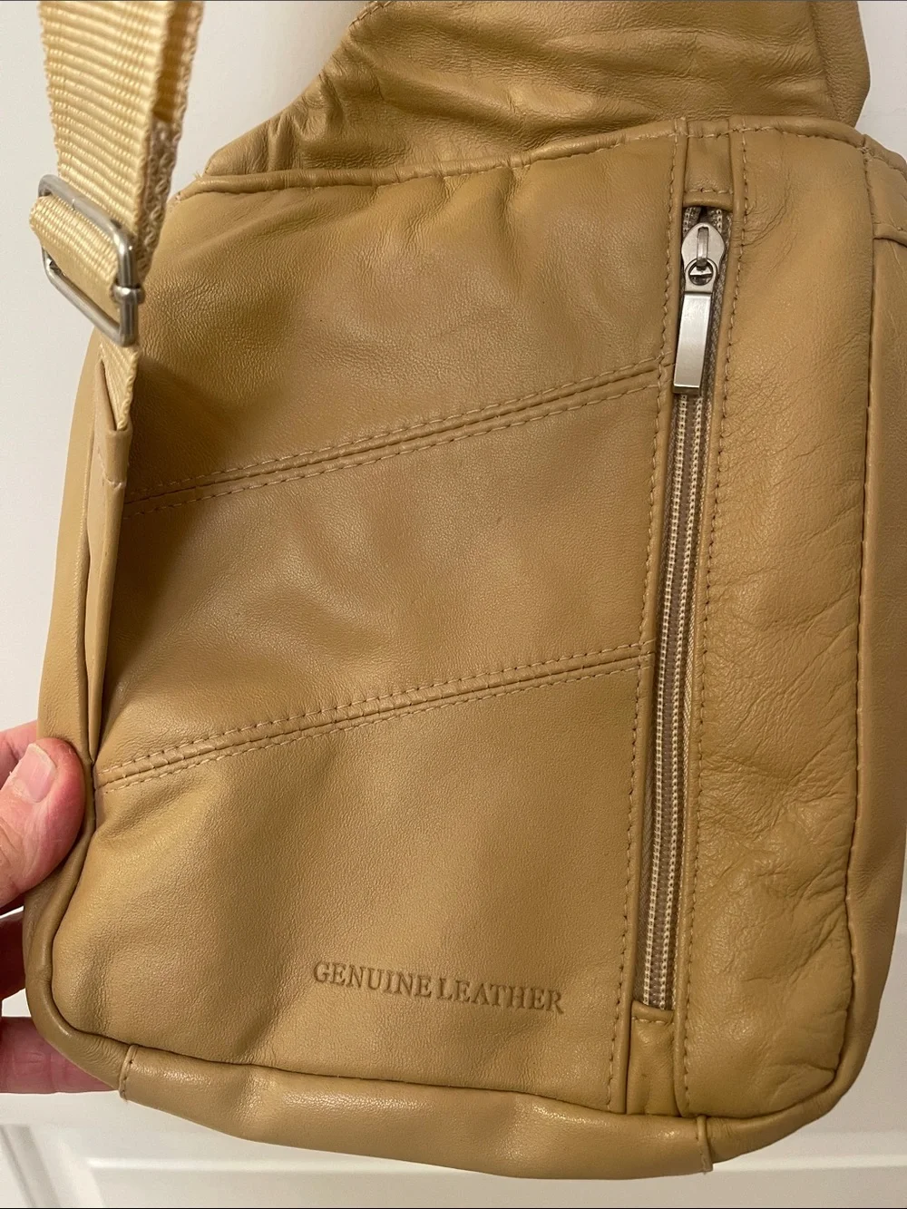 Buxton tan crossbody sling backpack